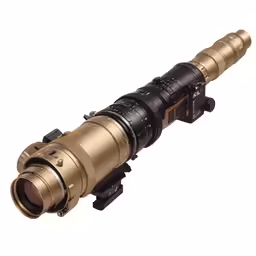 an antique gold telescope is mounted against a white backdrop