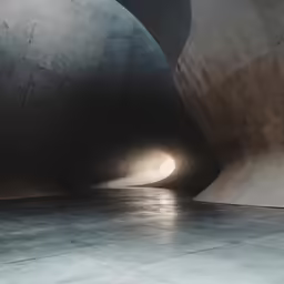 the light shines in the tunnel behind the man