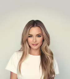 a woman with long blonde hair and a white shirt