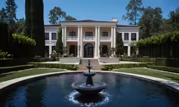 this is an image of a large mansion with a fountain