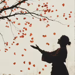 a woman standing underneath a tree while looking up at the leaves