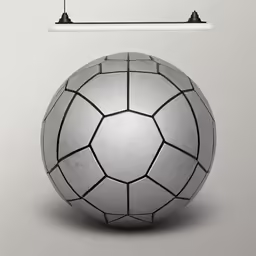 a white soccer ball and a light