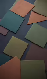 many different colored papers scattered on top of each other