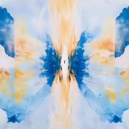 a photo taken looking up at blue and yellow clouds