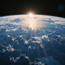 the sun is above the clouds above the earth