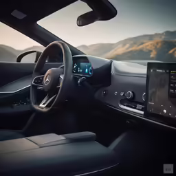 the interior of the car shows a steering wheel, dashboard and center console