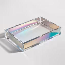 an iridescent tray sitting on top of a white table