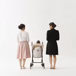 two women look at a baby in a stroller