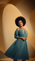 the woman in a dress is standing next to a wall
