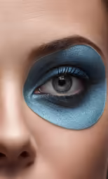 the eye makeup features a blue smokyliner