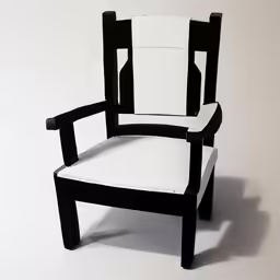 an empty chair has a white seat and black back