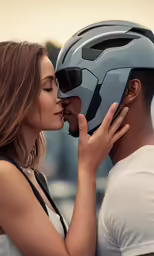 a man kissing a woman with a helmet on
