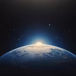 the sun is shining behind the earth