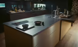 an image of a kitchen setting at night