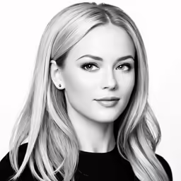a woman is in black and white posing