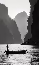 a man standing in the water while holding a fishing pole