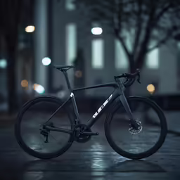 a bike parked on a dark street at night