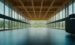 a empty room with some big windows looking outside