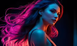 woman with flowing hair with pink and purple light