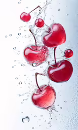 water drops on cherries in a bowl