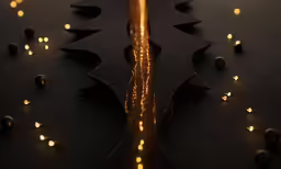 a metal object with lights shining on the surface