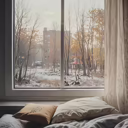 a window with a snowy outside view