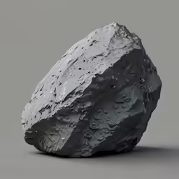 a rock on top of a gray surface