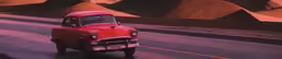 the old red car is driving down the road