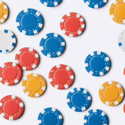 colored chips arranged in different shapes on a white background