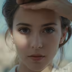 a beautiful young woman looking at the camera