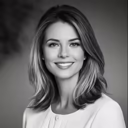 a woman in a white dress is smiling