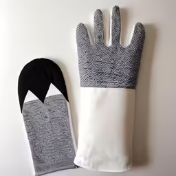 a glove and cover sitting on a table