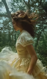 a woman is standing alone in the woods