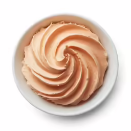 some kind of whipped cream in a white bowl