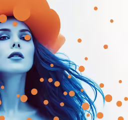 a girl with blue hair wearing orange polka dots