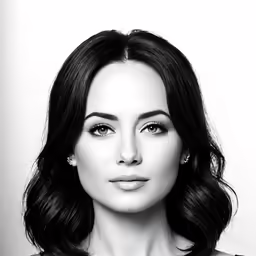 the beautiful brunette lady is posing for a picture