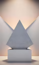 a large triangular stone statue on a platform