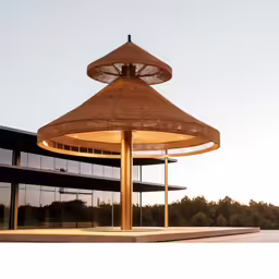 an umbrella lamp at the entrance to a building