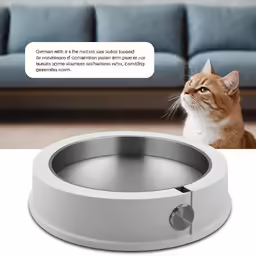 a cat is looking up at a remote