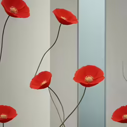 a vase holding red flowers with three separate ones