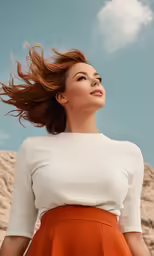 woman with brown hair leaning on wall in white top and orange skirt