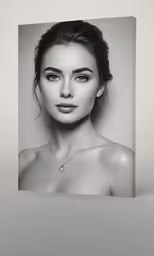 an attractive female poses for a black and white photo