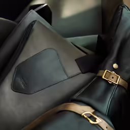 a black and gold suitcase sitting in a room