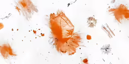 some watercolor paint drops on the side of a paper