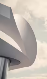 a tall building with a white wave design