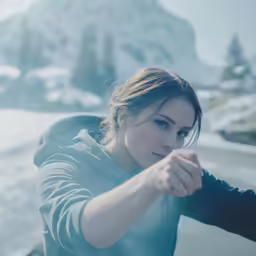 a woman is staring down while pointing her gun