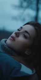 woman with earring on with a cold winter day