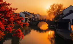 sunset over the river and old houses on the bank