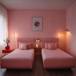 a pink room with two beds and bedside tables