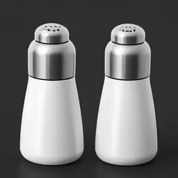 two salt and pepper shakers are sitting side by side